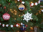 Ornament close-ups: snowflake, satin ball covers.
