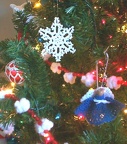 Ornament close-up:  snowflake and clothespin angel